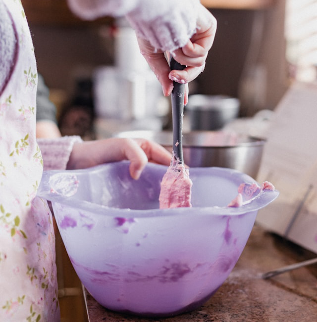 A baker using a spatula 